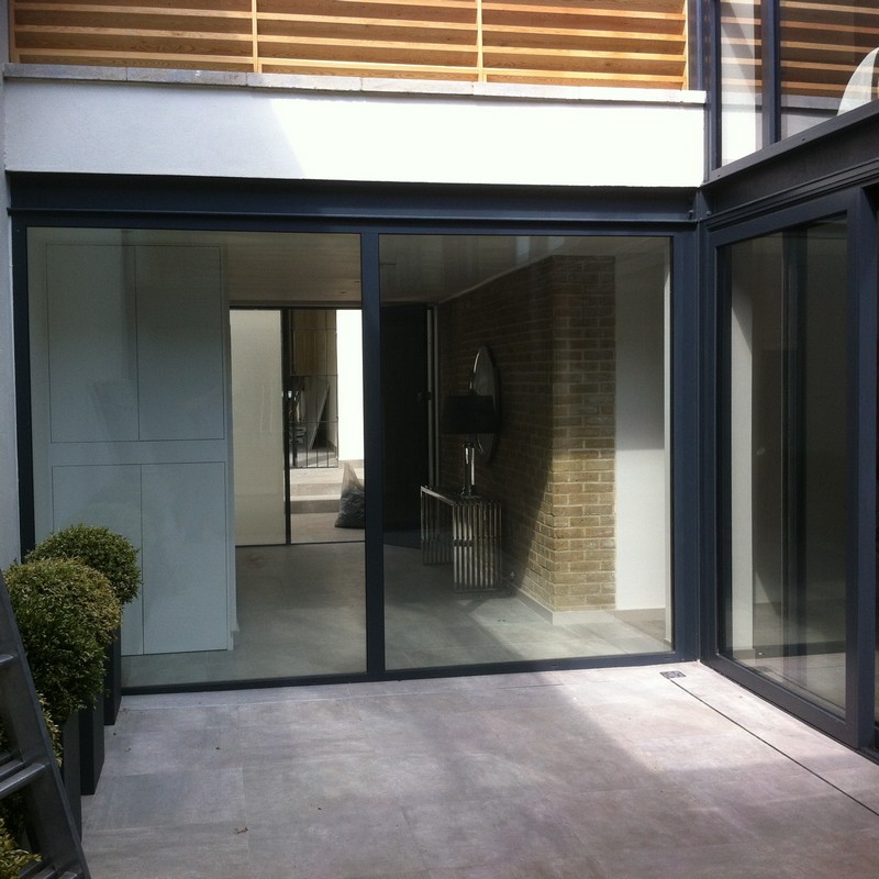 Floor-to-ceiling sliding doors opening to courtyard in Abingdon