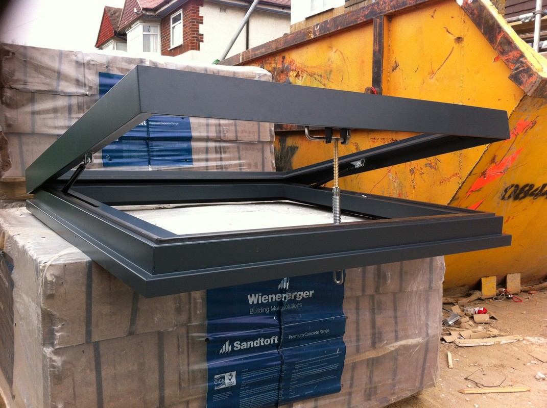Opening flat roof skylight in anthracite grey installed in Abingdon
