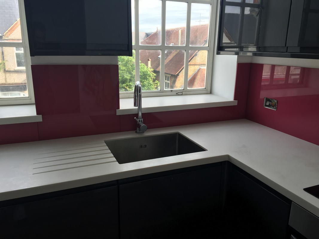 Deep plum coloured glass splashback in modern Abingdon kitchen